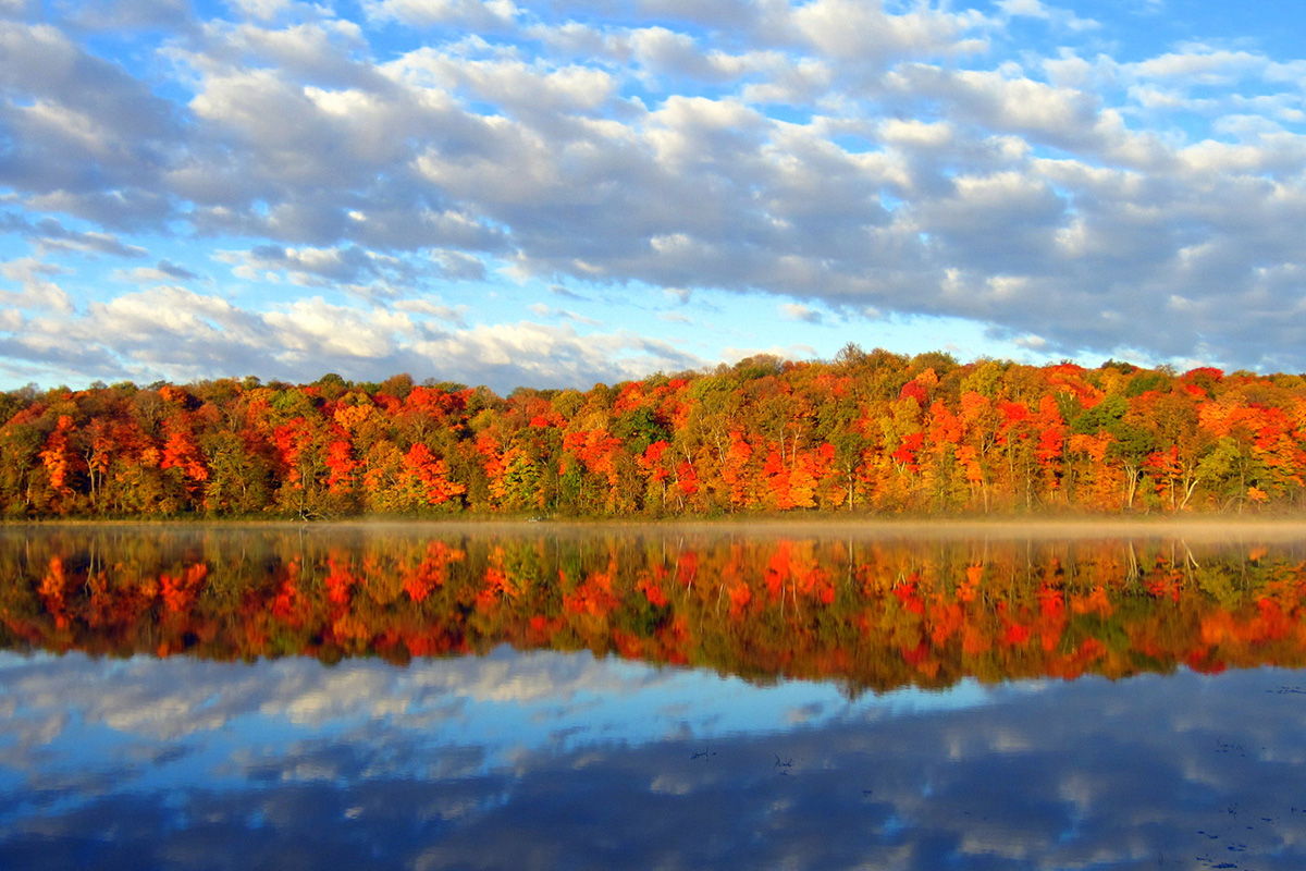 Outdoor fall colors by a crystal blue lake