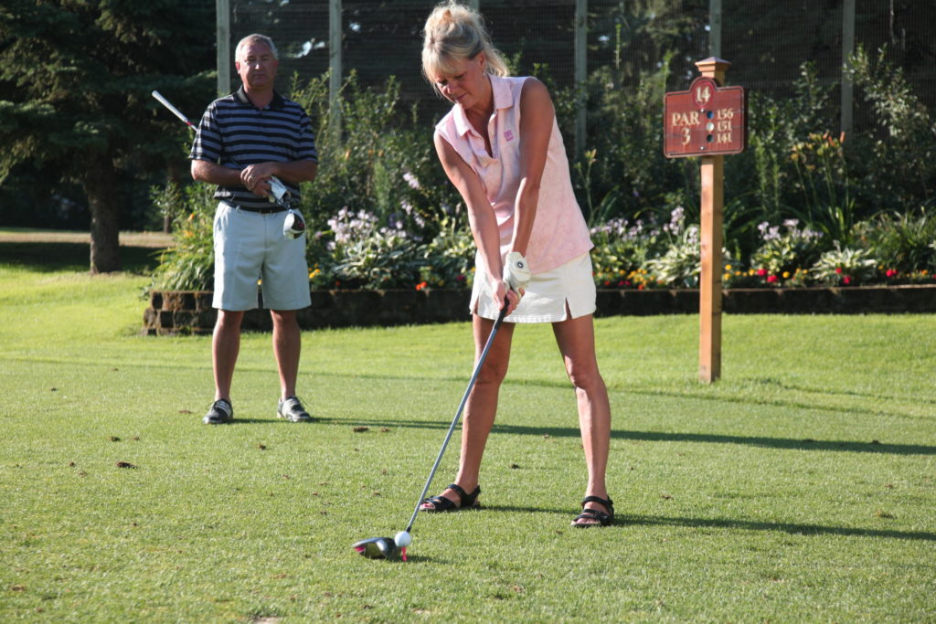 couple golfing