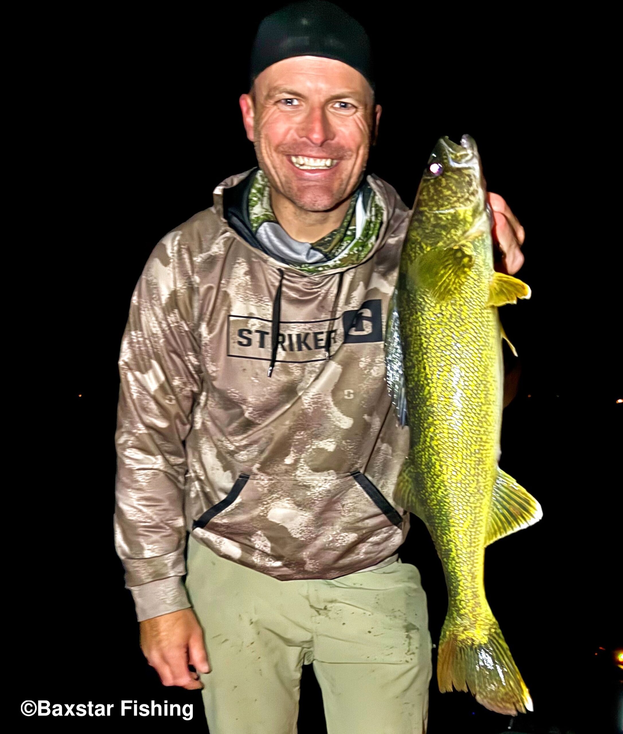 Man holding a walleye