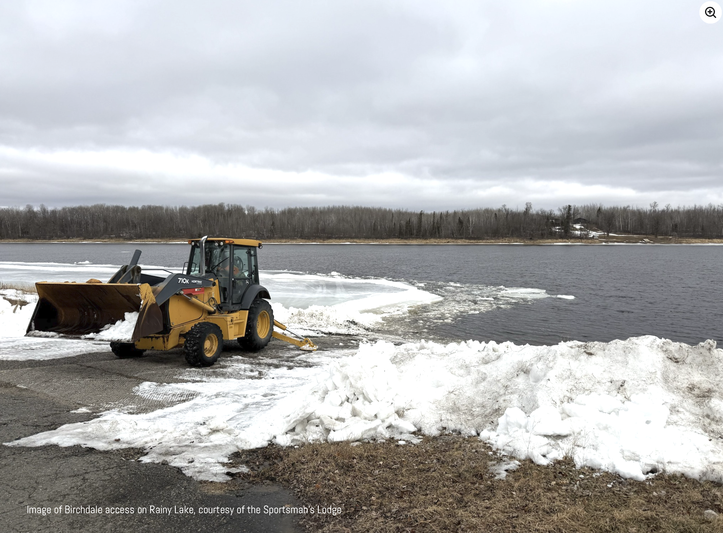 Equipment removing ice from Rainy Lake access